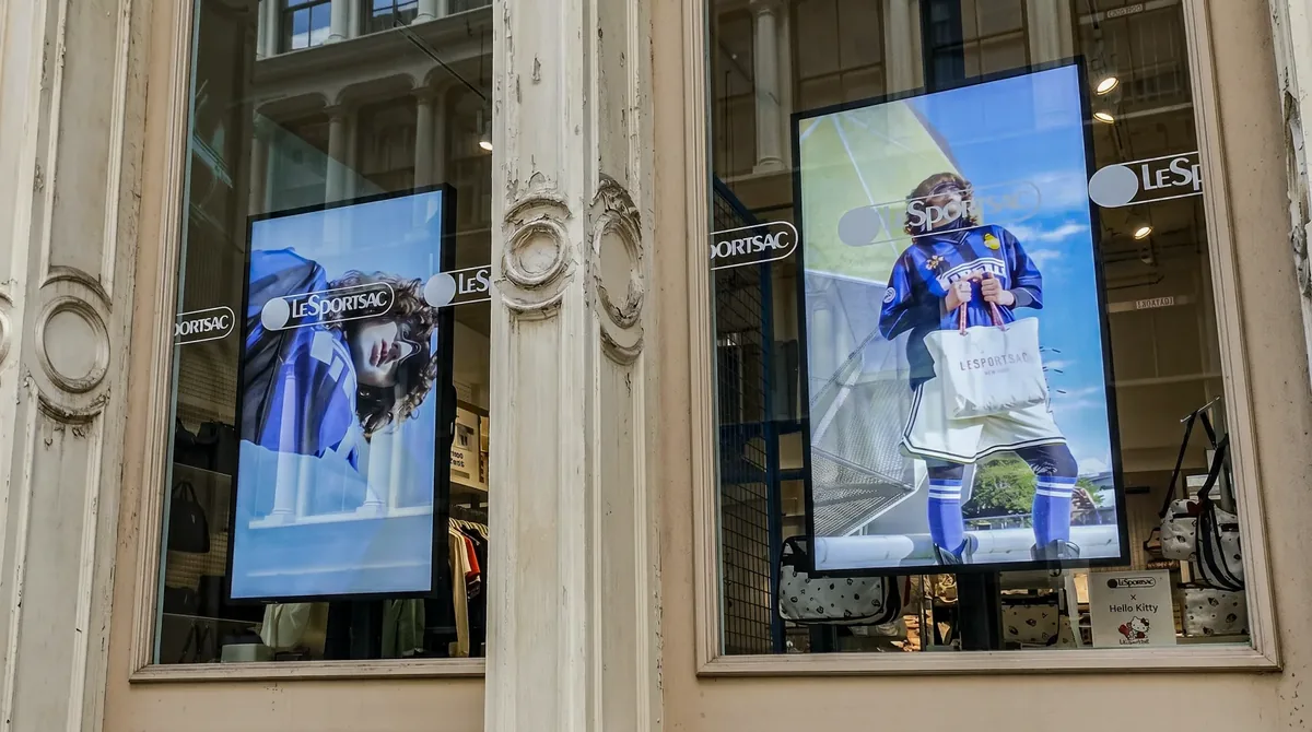 Two portrait digital window display screens at LeSportsac SoHo, Samsung OM55B